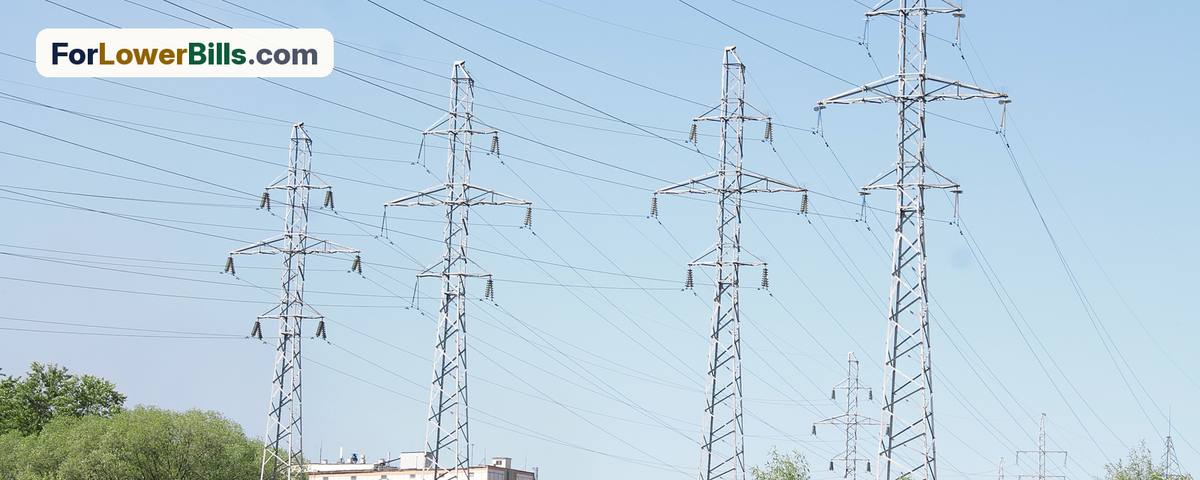 Electric power transmission towers against the sky